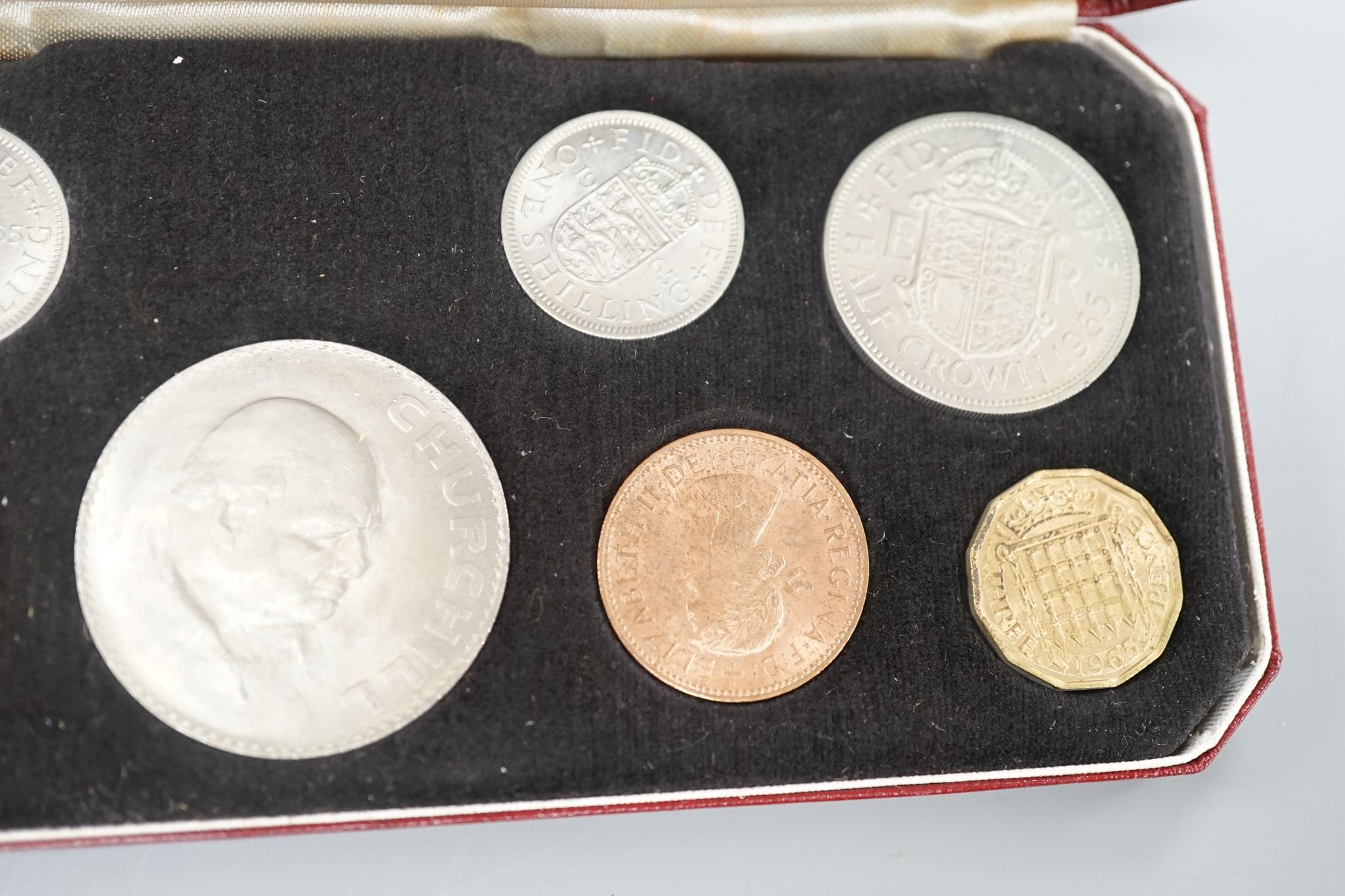 A Royal Mint Queen Elizabeth II cased set of coronation year coins 1953, UNC and a 1965 UNC set